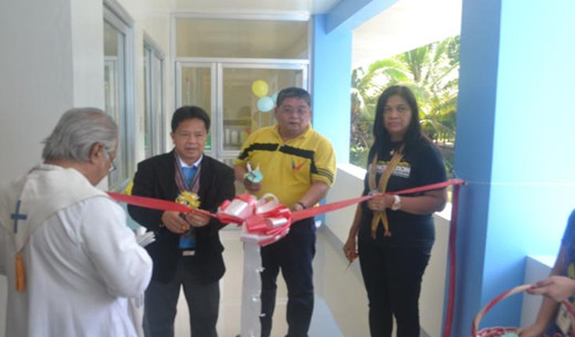 Dr. Patricio S. Faylon, leading the ribbon cutting ceremony following a brief religious invocation. With him are Mr. Ramon Rivera, PCA Deputy Administrator and Dr. Jocelyn E. Eusebio, Crops Research Division Director, PCAARRD.