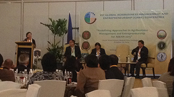 Senator Cynthia A. Villar while giving her speech during the fellowship night at the 1st Global Agribusiness Management and Entrepreneurship Conference. With her on stage are (from left to right) Mr. Guido Alfredo A. Delgado, President of UPLBCEMAFI, Dr. Dinah Pura T. Depositario, Conference Coordinator, and Dr. Fernando C. Sanchez, Jr., UPLB Chancellor (Photo by Christian L. Abeleda).