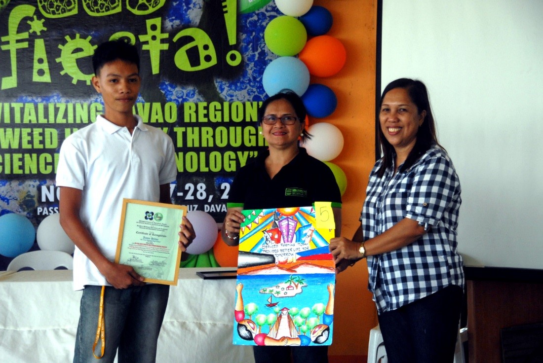 Mr. Jason Gilwa of the Santa Cruz National High School took the top spot in the on-the-spot poster and slogan making contest.