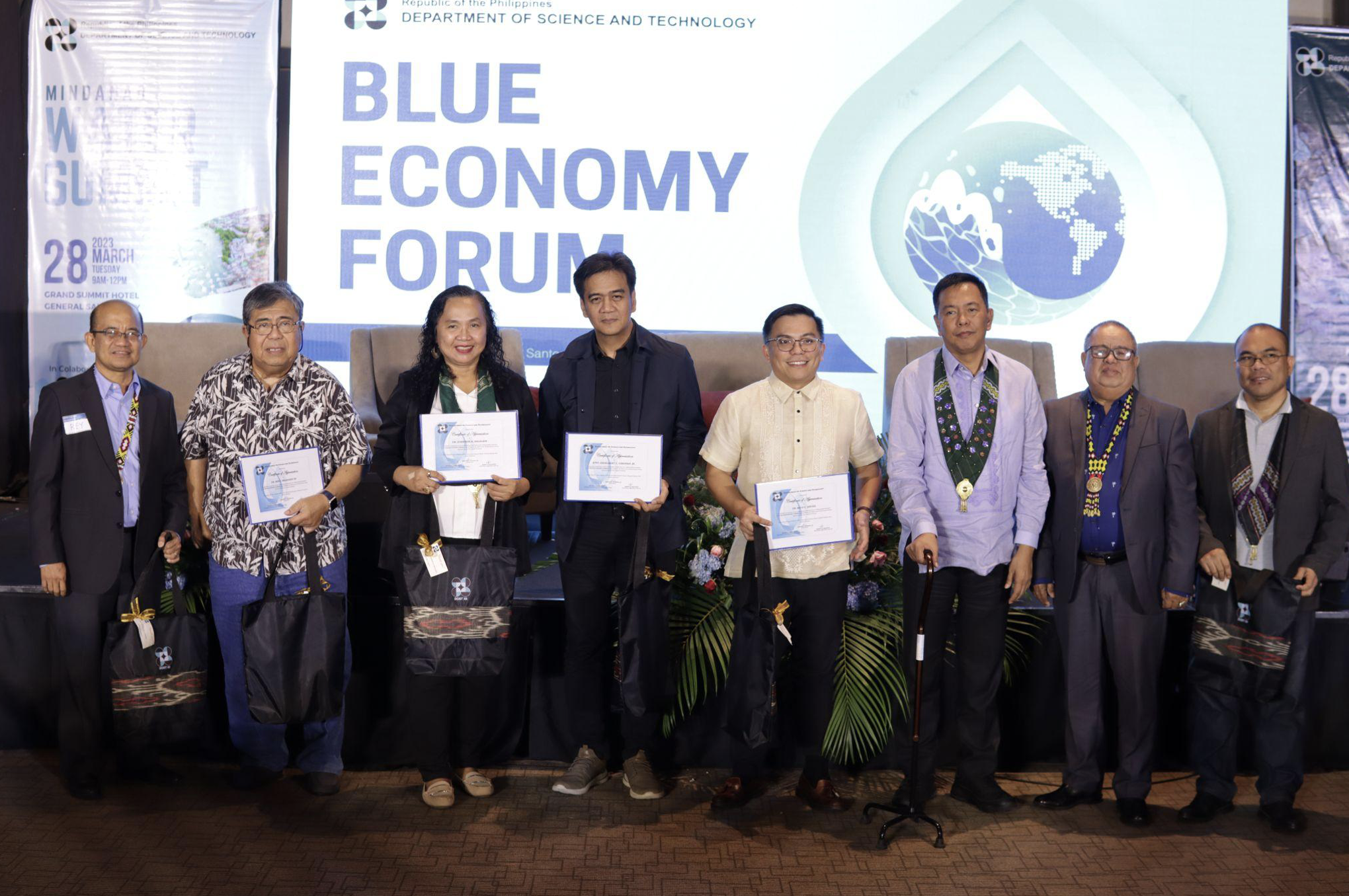 Blue Economy Forum speakers (2nd to 4th person from left): Professor Emeritus Ben Malayang; SOXAARRDEC Consortium Director Josephine Migalbin; Atty. Engelbert Caronan; UPLB-School of Environmental Science and Management Dean Rico C. Ancog; with DOST Officials: Undersecretary for Regional Operation Sancho A. Mabborang; DOST-XII Director Sammy P. Malawan; with Environmental Planner Jobe Tubigon (Image Credit: DOST 12)