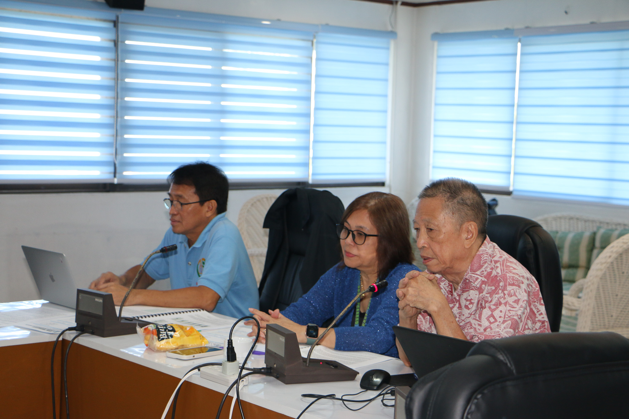 Dr. Francisco Elegado, Dr. Adelaida Calpe, and Mr. Wilfredo Yap (left to right) evaluating the projects under review.